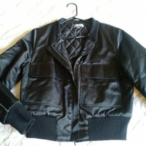 Black satin two pocket  jacket.